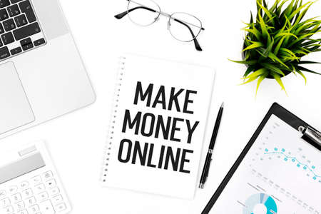 Text MAKE MANEY ONLINE on notebook, calculator, laptop. Business concept. Flat lay.の写真素材