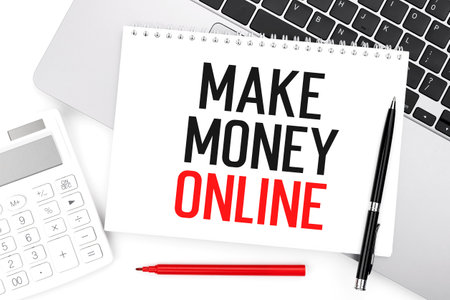 Text MAKE MANEY ONLINE on notebook, calculator, laptop. Business concept. Flat lay.の写真素材