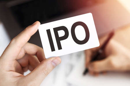 Business concept. Card with letters IPO - Initial Public Offering.の写真素材