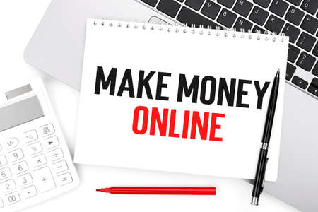 Text MAKE MANEY ONLINE on notebook, calculator, laptop. Business concept. Flat lay.の写真素材