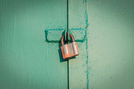 old rusty gates with padlocks