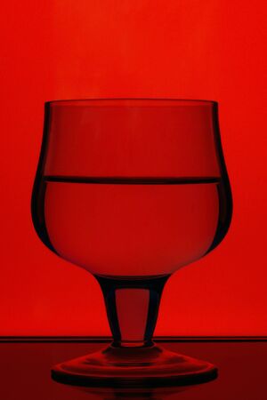 A glass of wine with a good reflectionの写真素材