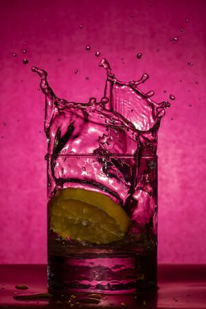 Drops from a glass of falling lemonの写真素材