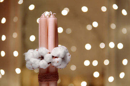 Pine cone with bow on wooden background texture.の写真素材