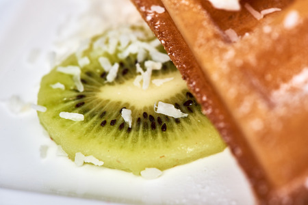Belgian waffles with banana and kiwi. Dessert Belgian waffles with banana and kiwi.の写真素材