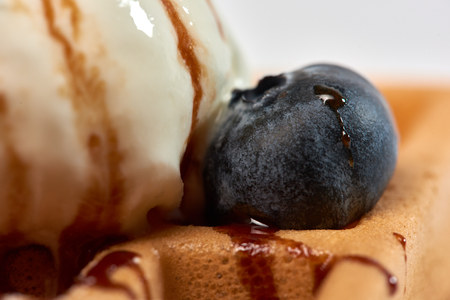 Dessert dish. Belgian waffles with ice cream, blueberries and raspberries.の写真素材