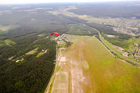 parachutist in the sky, view from above to earthの写真素材