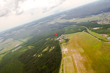 parachutist in the sky, view from above to earthの写真素材