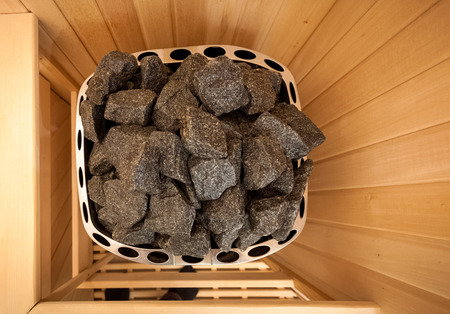 Wide angle shot of stones in sauna ovenの写真素材