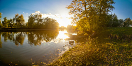 Beautiful ukrainian landscape of forest and river at sunsetの写真素材