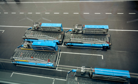 Parking of luggage carrying vehicles in modern airportの写真素材