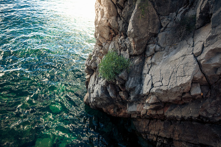 Beautiful view of high cliff in deep blue seaの写真素材