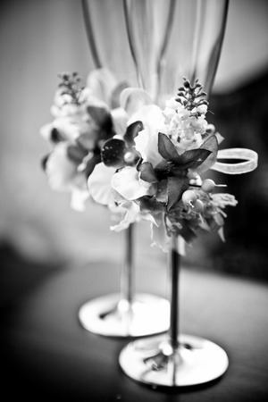 Black and white closeup shot of decorated wedding glassesの写真素材