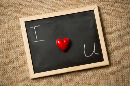 Conceptual photo of declaration of love written on black chalkboardの写真素材