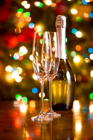 Beautiful Christmas background with glasses and bottle of champagneの写真素材