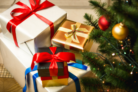 Christmas presents in colorful boxes on floor at living room