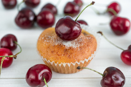 Macro photo of tasty homemade muffin with cherriesの写真素材