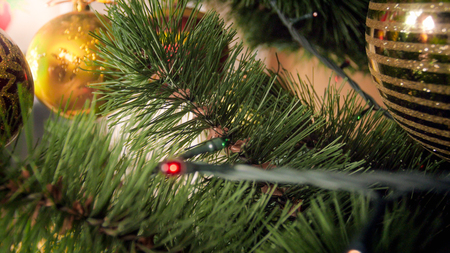 Closeup image of branches on decorated Christmas treeの写真素材