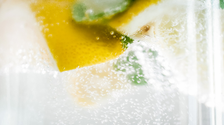 Macro photo of air bubble floating in glass of cold lemonadeの写真素材