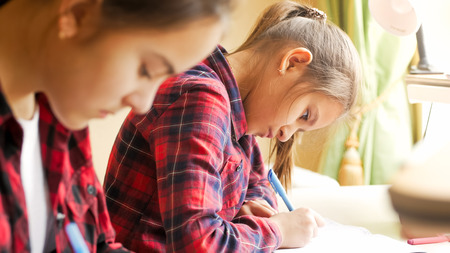 Closeup portrait of concentrated girl preparing for examsの写真素材