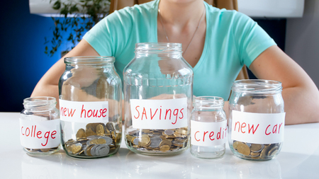 Closeup image of young woman managing her savingsの写真素材
