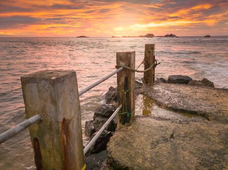 Amazing sunset sky and pier in the ocean