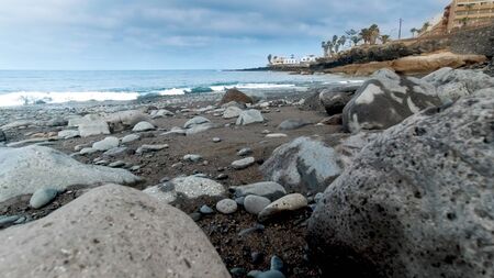 Closeup image of big rocks and cliffs on the ocean coastの写真素材