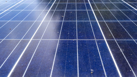 dirty and covered with dust solar energy panels installed on house roof. Concept of green energy and electricityの写真素材