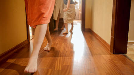 Big family with children walking out of their bedrooms wearing bathrobes at morning. Concept of...