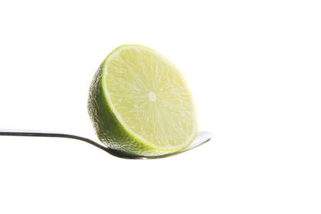 Fresh and juicy lime on spoon.の写真素材
