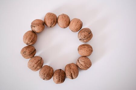 Old nuts on a white background.の写真素材