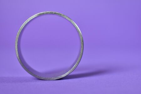 Metal silver circle.