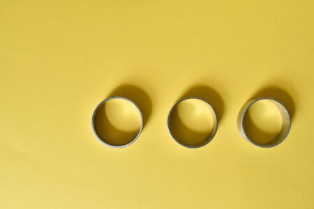 Metal wheels on a yellow background.の写真素材