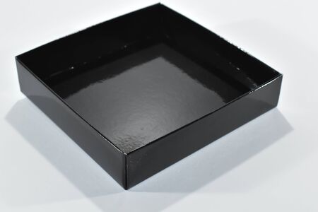 Black cardboard box on a white background.の写真素材