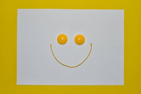 Yellow magnets and string on a white background,の写真素材