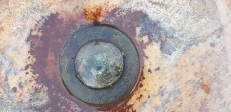 Old, rusty cork in the sink.の写真素材