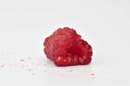 Red raspberries on a white background.の写真素材