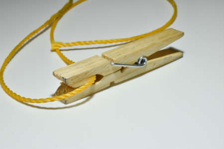 Wooden clip for hanging laundry.