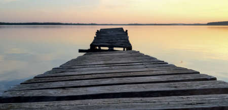 Old, wooden pier by the lake.の写真素材