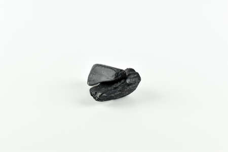 Pieces of dark soap.
