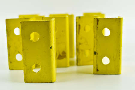 Metal, yellow square on a light background.の写真素材