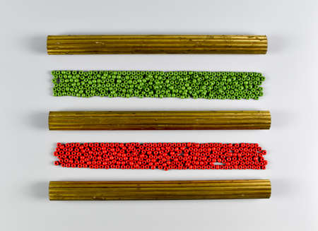 Colorful wooden beads and metal profiles.
