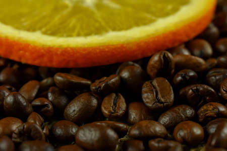 Coffee beans and orange, close-up, selective focus.の写真素材