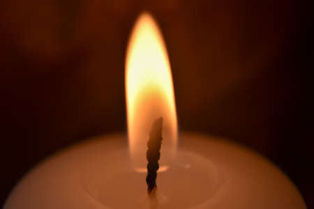 Candle flame closeup on a dark background. High quality photoの写真素材