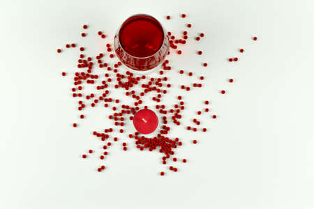 Red hearts and a glass of wine on a white background. 3d renderingの写真素材