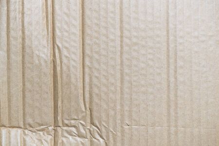 a crumpled brown cardboard wavy textureの写真素材