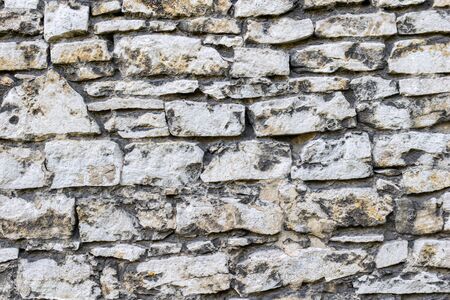 old wall made of limestone.の写真素材