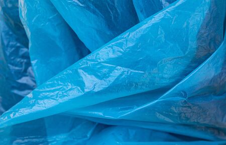 blue thin wrinkled foil texture.の写真素材