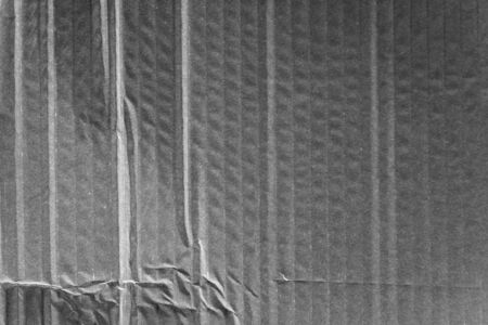 a crumpled black cardboard wavy textureの写真素材
