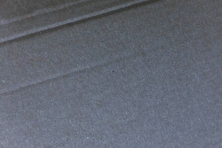 a crumpled black cardboard wavy textureの写真素材